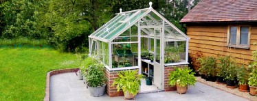 Front Entrance of a White Hartley Botanic 8x8 Tradition 8 Greenhouse.